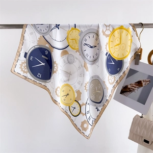 Close-up of vintage clock pattern silk scarf with elegant champagne gold hem detailing