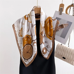 Vintage-style silk square scarf with clock and roman numeral print on a black dress hanger