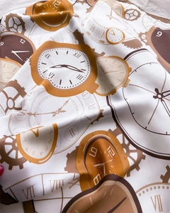 Macro detail of silk scarf featuring surreal melting clocks and vintage gear patterns