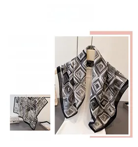 Detail of modern black and white geometric pattern scarf in high-quality faux silk texture