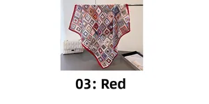 Detail of red geometric silk-feel scarf with herringbone pattern next to a luxury bag