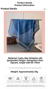 Close-up of geometric letter print silk-like scarf with black and white striped edges