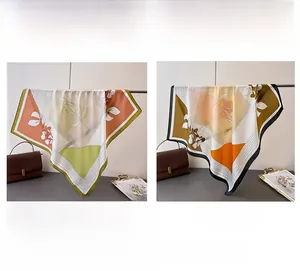 Detailed close-up of modern silk scarves featuring abstract patterns and vibrant color blocks