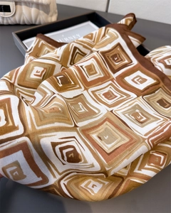 Detailed view of geometric herringbone pattern scarf with premium twill silk texture