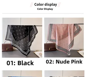 Detail showing draped geometric print silk scarves in black and soft pink on hangers