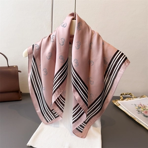 Elegant geometric print silk square scarf in dusty pink with striped borders for women