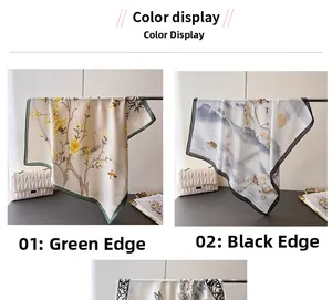 Detail view of silk scarves with green and black borders featuring landscape floral prints