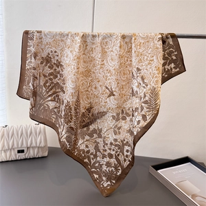 Detailed view of the vintage botanical print silk scarf with fine floral and bird motifs