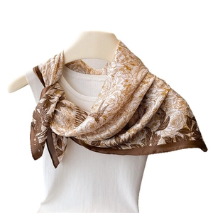 Floral and bird print silk-like satin square scarf with dark brown border on white mannequin