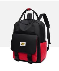 Close-up of the contrasting black and red colorblock backpack with buckle flip pocket