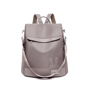 Gray multifunctional backpack in waterproof nylon with leather rabbit patch and straps