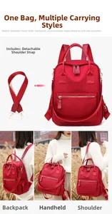 Detail of red waterproof nylon backpack with detachable strap showing multiple carrying styles