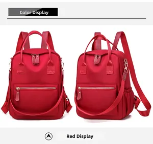 Detailed front and side view of red oxford backpack with dual zippers and side pockets