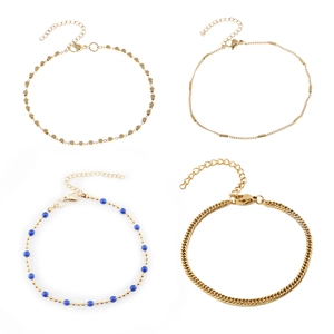 Set of four 18K gold plated stainless steel bracelets with beads and curb chain designs