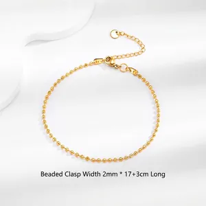 Detailed view of 2mm ball bead bracelet in 18K gold finish with lobster clasp and extension