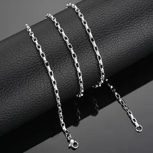 Detailed close-up of polished silver stainless steel box chain with lobster clasp