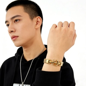 Polished men's gold stainless steel anchor link chain bracelet worn on wrist