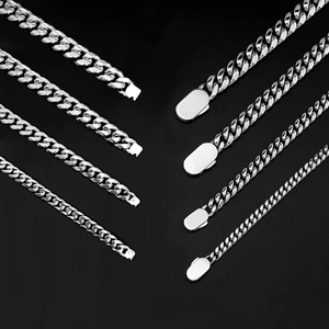 Detail showing multiple widths of silver stainless steel Cuban link chains with box clasp