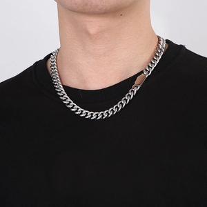 Close-up of hip hop stainless steel Cuban link chain necklace on male model's neck