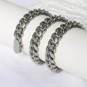 Macro shot of silver stainless steel Cuban chain necklace with high-polished mirror finish