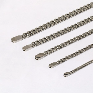 Detail view of five different widths of stainless steel Cuban link chains with clasps