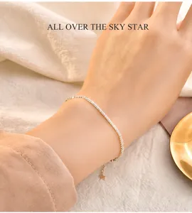 Detailed shot of a gold cauliflower chain bracelet featuring a delicate star pendant