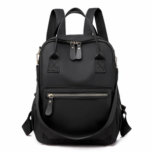Classic black oxford fabric backpack with golden hardware and spacious main compartment