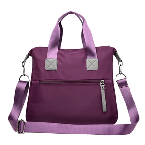 Deep purple multi-pocket nylon shoulder bag with adjustable strap and top handles