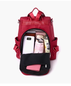Large capacity interior of the embroidery backpack showing pockets for tablet and gear