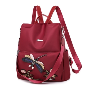 Waterproof dark red oxford backpack with ethnic floral embroidery and adjustable straps
