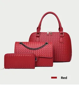 Three-piece red woven bag set including a large tote, chain crossbody and wallet
