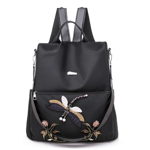 Waterproof black oxford backpack featuring dragonfly embroidery and rhinestone accents
