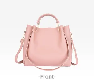 Vue de face du sac cabas rose en similicuir avec bandoulière et poignées supérieures