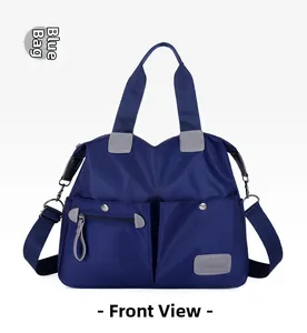 Close-up of front pockets and durable nylon texture on large blue multi-pocket tote bag