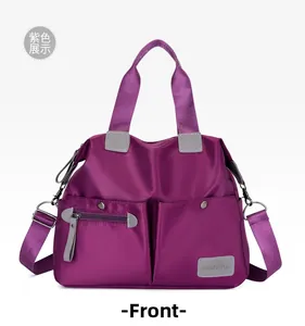 Front view of purple nylon tote bag with multi-pockets and adjustable shoulder strap