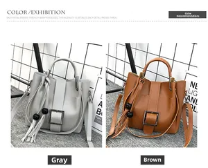 Details zu grauen und braunen Beuteltaschen mit Metallschnallen und Quastenanhängern