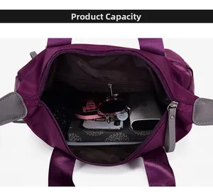 Top-down detail showing the spacious interior of the purple nylon tote with daily essentials
