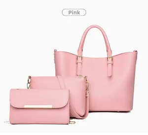 Detailed view of a 3-piece set pink leather tote bag with shoulder bag and wallet