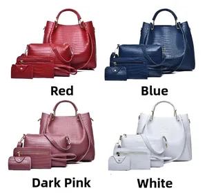 Detail view of crocodile pattern embossed handbags set in red, blue, pink and white