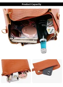 Brown crocodile pattern tote bag interior with multiple compartments for tablet and water