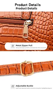 Detail of golden zipper and adjustable buckle on orange crocodile embossed bag