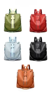 Detail view of woven textured PU backpacks in green, wine red, blue, black, and yellow brown