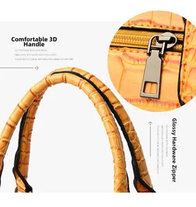 Détail de la poignée confortable et du fermoir en métal brillant sur un sac en crocodile