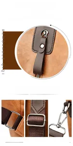 Detailed view of brown lychee-textured leather straps with silver hardware and zipper