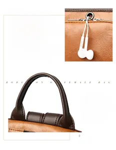 Detail of the earphone port and comfortable brown leather handle on a large backpack