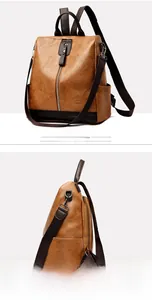 Detailed side view of yellow-brown PU leather backpack with vertical zipper and nylon straps