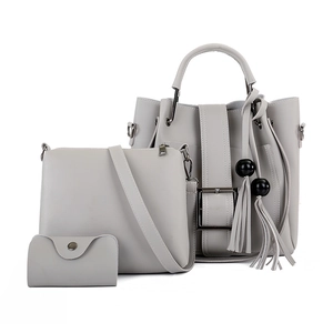 Graues dreiteiliges Damen Handtaschen Set inklusive großer Tragetasche mit Quasten Anhänger