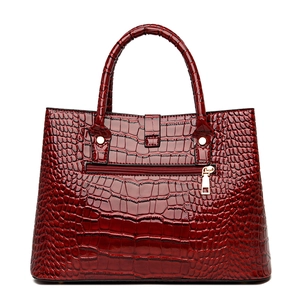 Polished bright red crocodile pattern leather handbag with gold hardware and back zipper pocket