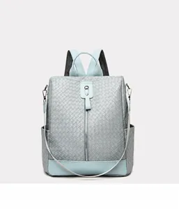 Front view of grey-blue woven texture backpack with decorative vertical zippers