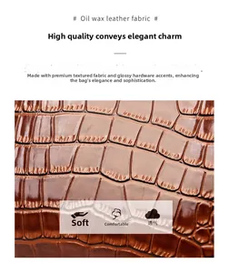 Close-up of brown crocodile embossed leather handbag with soft polished oily finish